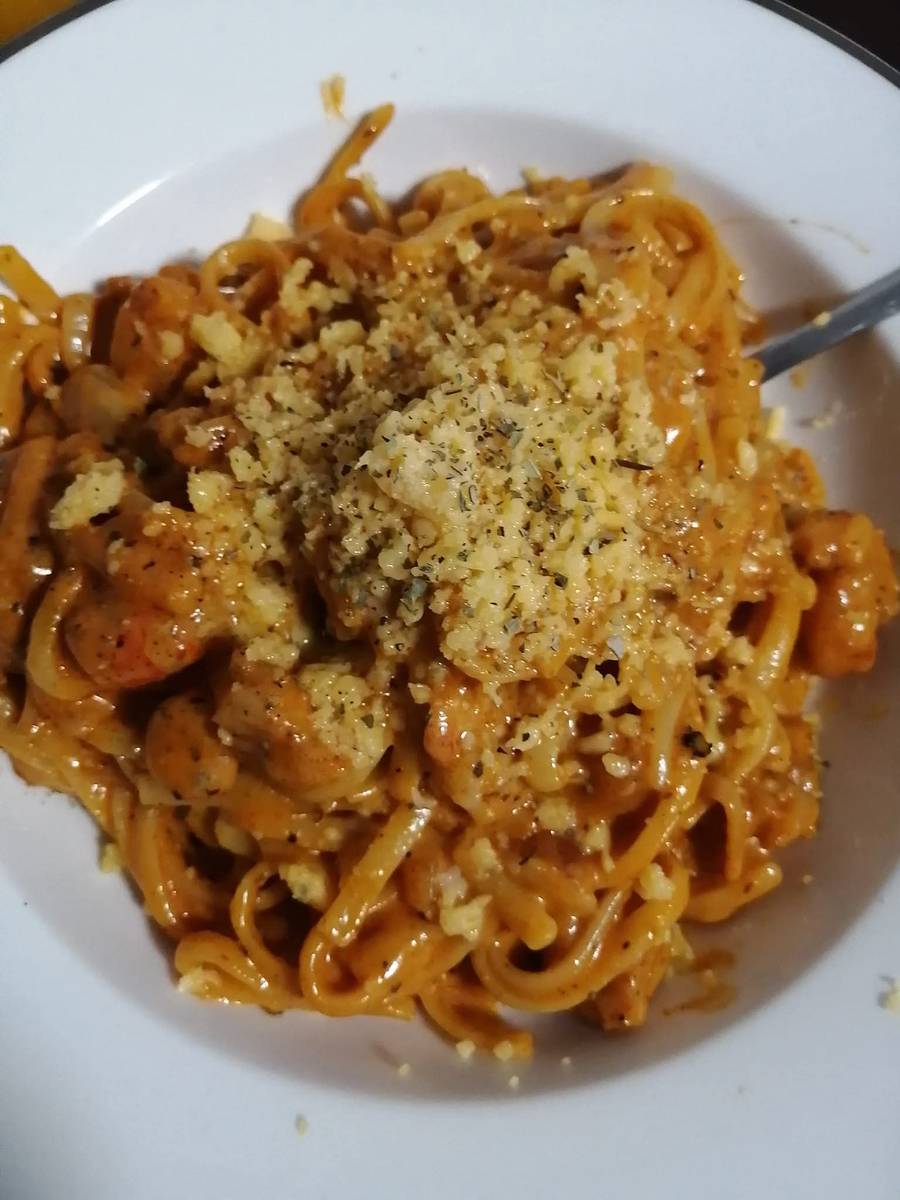 Creamy spicy pasta topped with cheese